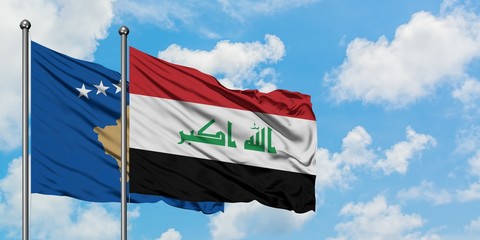 Kosovo and Iraq flag waving in the wind against white cloudy blue sky together. Diplomacy concept, international relations.