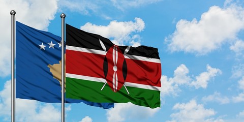 Kosovo and Kenya flag waving in the wind against white cloudy blue sky together. Diplomacy concept, international relations.