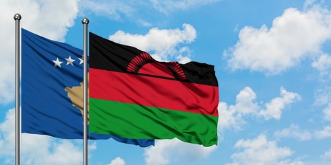 Kosovo and Malawi flag waving in the wind against white cloudy blue sky together. Diplomacy concept, international relations.