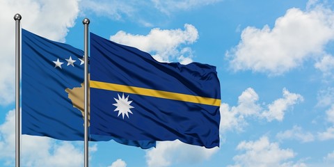 Kosovo and Nauru flag waving in the wind against white cloudy blue sky together. Diplomacy concept, international relations.