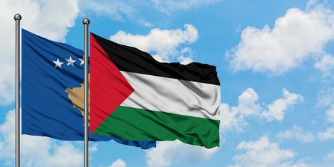 Kosovo and Palestine flag waving in the wind against white cloudy blue sky together. Diplomacy concept, international relations.