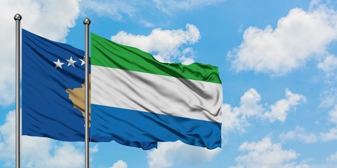 Kosovo and Sierra Leone flag waving in the wind against white cloudy blue sky together. Diplomacy concept, international relations.