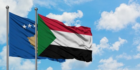 Kosovo and Sudan flag waving in the wind against white cloudy blue sky together. Diplomacy concept, international relations.