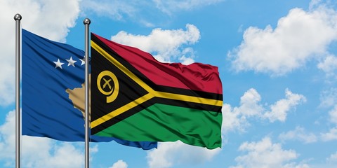 Kosovo and Vanuatu flag waving in the wind against white cloudy blue sky together. Diplomacy concept, international relations.