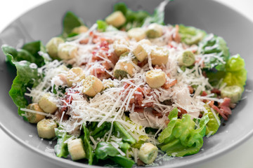 Close up ceasar salad on the plate and white background