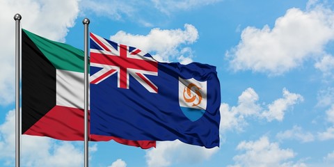 Kuwait and Anguilla flag waving in the wind against white cloudy blue sky together. Diplomacy...