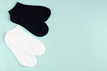 Kids socks composition on blue background. Flat lay.