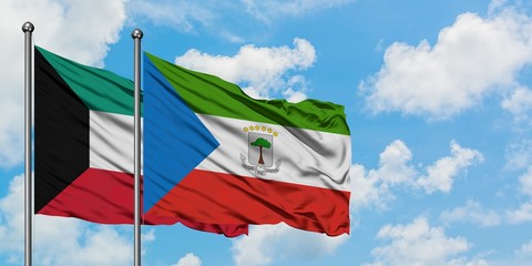 Kuwait and Equatorial Guinea flag waving in the wind against white cloudy blue sky together. Diplomacy concept, international relations.