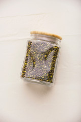 Beas in glass on a white textured background. Sustainable lifestyle concept, zero waste, eco...