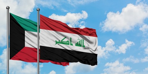 Kuwait and Iraq flag waving in the wind against white cloudy blue sky together. Diplomacy concept,...