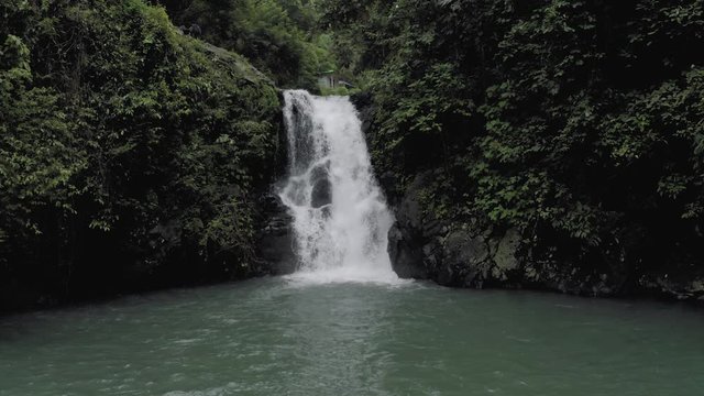 Waterfall in Bali Island tropical mountains 4K Drone flight