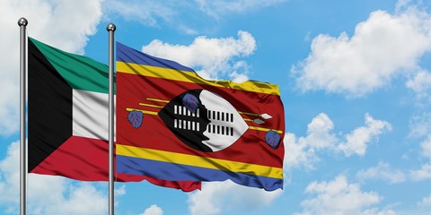 Kuwait and Swaziland flag waving in the wind against white cloudy blue sky together. Diplomacy concept, international relations.