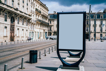 Line of clear billboards on city street with blank copy space screen for advertising or promotional poster content, empty mockup Lightboxes for information, blank displays outdoors in urban area © BullRun