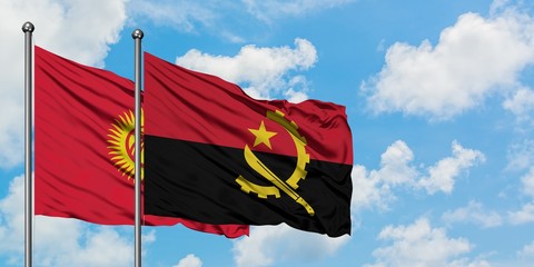 Kyrgyzstan and Angola flag waving in the wind against white cloudy blue sky together. Diplomacy...