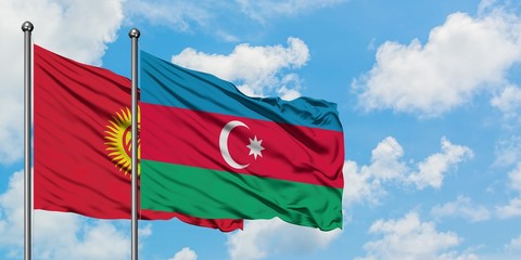 Kyrgyzstan and Azerbaijan flag waving in the wind against white cloudy blue sky together. Diplomacy concept, international relations.