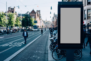 Clear Billboard on city street with blank copy space screen for advertising or promotional poster content, empty mock up Lightbox for information, blank display outdoors in urban area