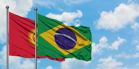 Kyrgyzstan and Brazil flag waving in the wind against white cloudy blue sky together. Diplomacy concept, international relations.