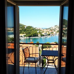 Gruž, a neighborhood in Dubrovnik, Croatia, Adriatic sea. Harbor and bay. Harbor boats. Port, harbor, ferry terminal, cruise port. Yacht Club. A harbor with white boats and yachts. Cruise ships