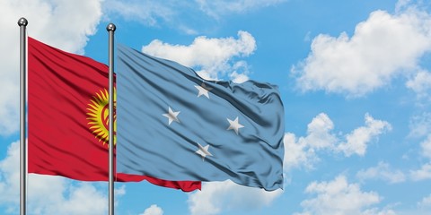 Kyrgyzstan and Micronesia flag waving in the wind against white cloudy blue sky together. Diplomacy concept, international relations.