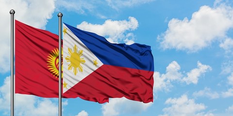 Kyrgyzstan and Philippines flag waving in the wind against white cloudy blue sky together. Diplomacy concept, international relations.