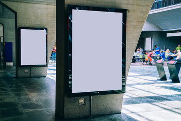 Clear Billboard in public place with blank copy space screen for advertising or promotional poster content, empty mock up Lightbox for information, blank display in station area with daylight © BullRun