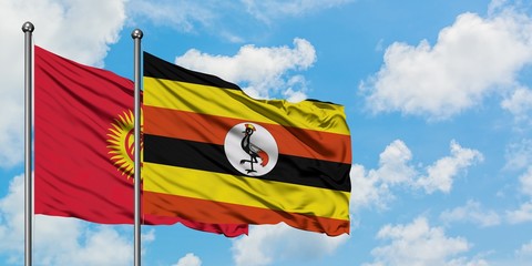 Kyrgyzstan and Uganda flag waving in the wind against white cloudy blue sky together. Diplomacy concept, international relations.