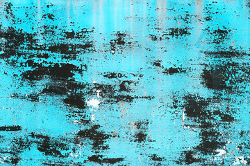 Texture blue paint peeling from wall from old age. For background