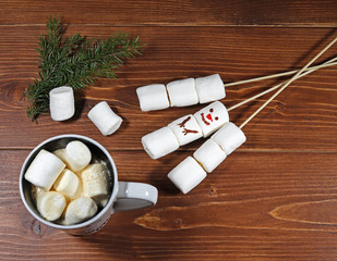 Coffee Cup with marshmallow on wooden background