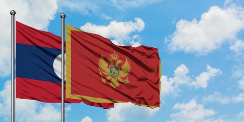 Laos and Montenegro flag waving in the wind against white cloudy blue sky together. Diplomacy concept, international relations.