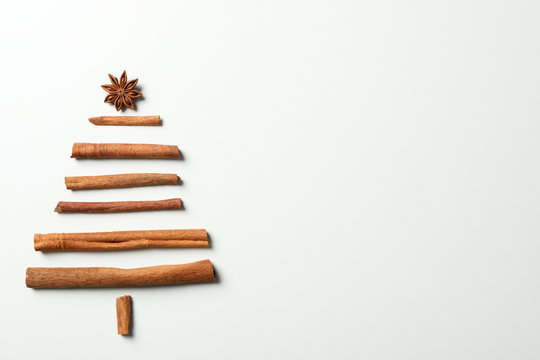 Christmas tree made of cinnamon on grey background, space for text