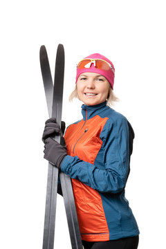 Image of smiling sportswoman with skis on empty white background.