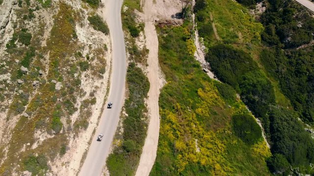 Top view down two ATVs riding mountain road, Cyprus