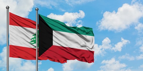 Lebanon and Kuwait flag waving in the wind against white cloudy blue sky together. Diplomacy concept, international relations.