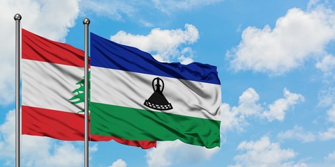 Lebanon and Lesotho flag waving in the wind against white cloudy blue sky together. Diplomacy concept, international relations.