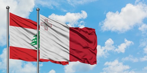 Lebanon and Malta flag waving in the wind against white cloudy blue sky together. Diplomacy concept, international relations.