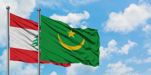 Lebanon and Mauritania flag waving in the wind against white cloudy blue sky together. Diplomacy concept, international relations.