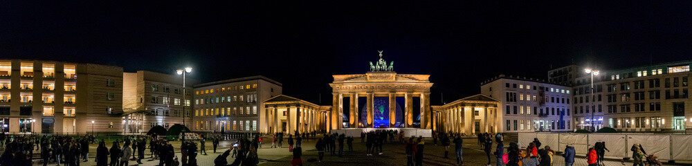 Panoramic view famous Brandenburger Tor (Brandenburg Gate) viewed from the Pariser Platz on the East side at night, one of the best-known landmarks and national symbols of Germany Visions in Motion © snapshotfreddy