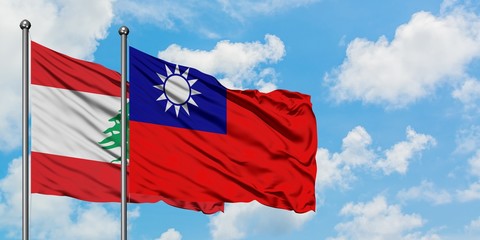 Fototapeta na wymiar Lebanon and Taiwan flag waving in the wind against white cloudy blue sky together. Diplomacy concept, international relations.