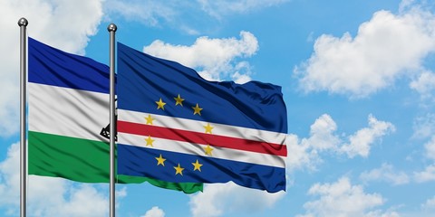 Lesotho and Cape Verde flag waving in the wind against white cloudy blue sky together. Diplomacy concept, international relations.