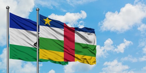Lesotho and Central African Republic flag waving in the wind against white cloudy blue sky together. Diplomacy concept, international relations.