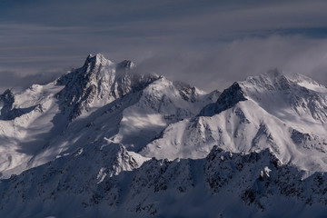 Fototapeta na wymiar Mountain peak in the mountains. View over the Alps, from Kaunertal Glacier area, in Tyrol, Austria.