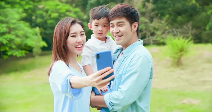 Young parent take selfie with child