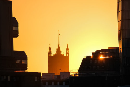 beautiful view from millennium bridge of One Blackfriars tower and westminster parliament tower in the distance during sunset in London, England, UK