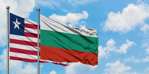 Liberia and Bulgaria flag waving in the wind against white cloudy blue sky together. Diplomacy concept, international relations.