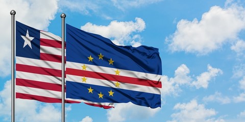 Liberia and Cape Verde flag waving in the wind against white cloudy blue sky together. Diplomacy concept, international relations.