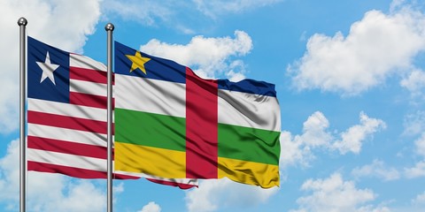Liberia and Central African Republic flag waving in the wind against white cloudy blue sky together. Diplomacy concept, international relations.