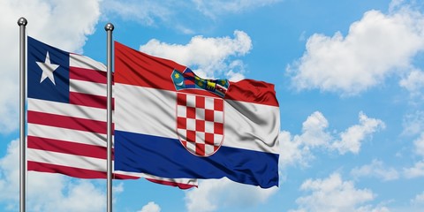 Liberia and Croatia flag waving in the wind against white cloudy blue sky together. Diplomacy concept, international relations.