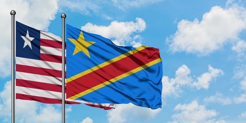 Liberia and Congo flag waving in the wind against white cloudy blue sky together. Diplomacy concept, international relations.