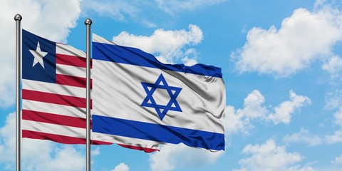 Liberia and Israel flag waving in the wind against white cloudy blue sky together. Diplomacy concept, international relations.