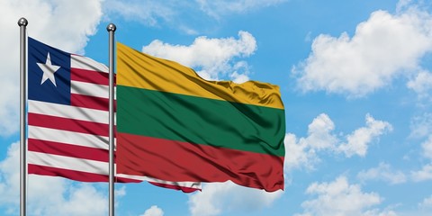 Liberia and Lithuania flag waving in the wind against white cloudy blue sky together. Diplomacy concept, international relations.